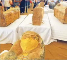  ?? Reuters ?? Painted ancient coffins are seen at Al-Asasif necropolis, unveiled by Egyptian antiquitie­s officials in the Valley of the Kings in Luxor on Saturday.