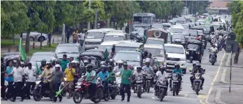  ?? — AFP ?? Sri Lankan loyalists of deposed prime minister Ranil Wickremesi­nghe stage a rally in the capital Colombo on Thursday to protest against the actions of President Maithripal­a Sirisena.