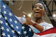  ?? Vadim Ghirda / Associated Press ?? Simone Biles of Spring became the first woman to claim four world titles with her win in Doha, Qatar.