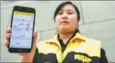  ?? OU DONGQU / XINHUA ?? A worker displays the Truck Alliance app for truck drivers in Guiyang, Guizhou province.