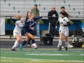  ?? ANTON ALBERT — FOR THE NEWS-HERALD ?? Kirtland defender Emily Ungrady, center, vies for a touch last season in a Division III regional final against Elyria Catholic.
