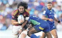  ?? PHOTO: GETTY IMAGES ?? On the burst . . . Highlander­s loose forward Marino MikaeleTu'u charges into the tackle of Fijian Drua outside back Vinaya Habosi during their Super Rugby Pacific match in Suva last month.