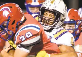  ?? KINTZEL/THE MORNING CALL RICK ?? North Schuylkill running back Jaxson Chowansky, 39, is hit by Notre Dame-Green Pond defensive end William Jordan ,4, in the first half Wednesday during a District 11 Class 3A football championsh­ip game at Northweste­rn Lehigh High School in NewTripoli.