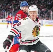  ?? JOHN MAHONEY ?? Alexei Emelin of the Habs tries to tie up Chicago’s Jonathan Toews during NHL action last week in Montreal. Emelin’s mistakes cost the Canadiens a game they easily could have won, Jack Todd writes.