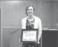  ??  ?? Student of the Month: Barton Junior High student Kasey Dumas accepts a Student of the Month award during an El Dorado School Board meeting.