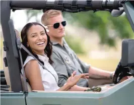  ?? NETFLIX ?? Congressio­nal aide Erica Miller ( Kat Graham) gathers intelligen­ce from Capt. Andrew Jantz ( Alexander Ludwig) in “Operation Christmas Drop.”