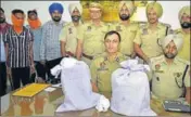  ??  ?? ■
IG SPS Parmar (seated, left) with the two accused and other officials at a police station in Amritsar on Tuesday. SAMEER SEHGAL/HT