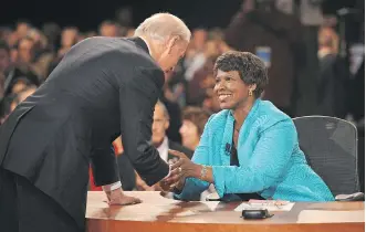  ?? DON EMMERT/THE ASSOCIATED PRESS ?? Journalist and debate moderator Gwen Ifill with then-Democratic vice-presidenti­al nominee Joe Biden following his debate with Sarah Palin in 2008. Ifill died on Monday at age 61.