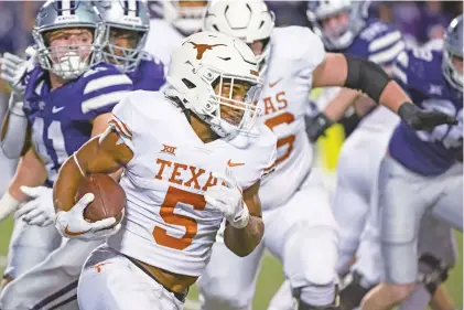  ?? REED HOFFMANN/ASSOCIATED PRESS FILE PHOTO ?? Texas running back Bijan Robinson was chosen No. 8 by the Falcons in the NFL Draft on Thursday. He is a rare first-round selection.