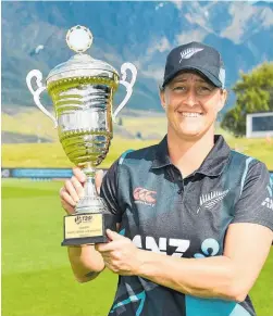  ?? Photo / Photosport ?? White Ferns captain Sophie Devine with the spoils of victory at John Davies Oval in Queenstown.