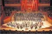  ?? Gary Murphy ?? GRANT GERSHON conducts the Master Chorale in a performanc­e of “Lux Aeterna” at Disney Hall.