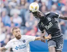  ??  ?? Vancouver’s Kei Kamara gets his head on the ball above San Jose’s Guram Kashia.