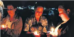  ?? ?? Candles were lit in memory of loved ones