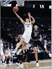  ?? AP/FRANK FRANKLIN II ?? Connecticu­t’s Gabby Williams (15) drives past South Carolina’s Mikiah Herbert Harrigan (21) during the second half of the Huskies’ 94-65 victory over the Gamecocks in the Albany Regional final. Williams led the Huskies with 23 points.