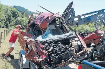  ?? Photo: CALEB HARRIS/FAIRFAX NZ ?? Mangled heap: The injured driver and sole occupant of this crashed car crawled out of the wreckage and made his way along an electric fence to seek help. His friends could not believe he suffered only moderate injuries.