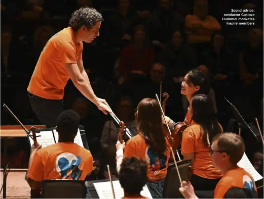  ??  ?? Sound advice: conductor Gustavo Dudamel motivates Inspire members