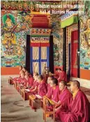  ??  ?? Tibetan monks in the prayer hall at Rumtek Monastery.