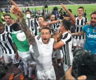  ?? REUTERS ?? Juventus midfielder Claudio Marchisio leads the title celebratio­ns after Sunday’s 0-0 draw at Roma.