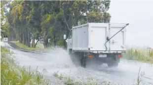  ??  ?? A deluge of rain on Thursday caused flash flooding across Number One Rd, Warragul.