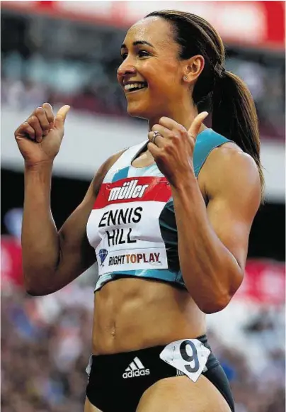  ??  ?? PERFECT TIMING: Jessica Ennis-Hill celebrates following her heat of the women’s 100m hurdles