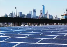  ?? MARK LENNIHAN/AP ?? A rooftop is covered with solar panels in New York. Some analysts believe that plans to boost U.S. solar production are unlikely to create tons of jobs as factories have become increasing­ly automated.