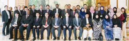  ??  ?? Participan­ts of the Sukuk Model Law workshop pose for a group photo in Bandar Seri Begawan, Brunei Darussalam.