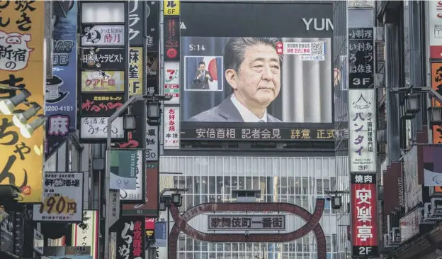  ?? PICTURE: CARL COURT/ GETTY ?? 0 Japan’s prime minister, Shinzo Abe, is displayed on a giant TV screen in Tokyo during a press conference in which he announced his resignatio­n