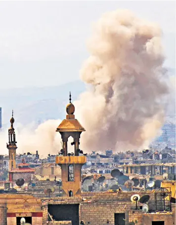  ??  ?? Smoke billows over Damascus following a reported air strike on the rebel-held parts of the Jobar district yesterday