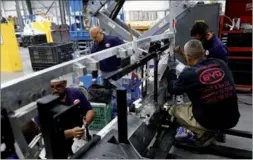  ?? BLOOMBERG ?? Employees manufactur­e electric vehicles at the BYD Coach and Bus factory in Lancaster, California.