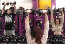  ?? ALEX HORVATH / THE CALIFORNIA­N ?? Kaitlyn Hill, right, works out at Planet Fitness at 2300 White Lane in this January 2020 file photo. As Kern County continues to progress through tiers in the state’s Blueprint for a Safer Economy, gyms and fitness centers will continue to expand their capacity.