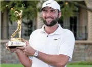  ?? Today Sports /David Yeazell/USA ?? Two-time champion: Scottie Scheffler poses with the Champions trophy after winning The Players Championsh­ip.