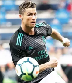  ?? — Reuters photo ?? Cristiano Ronaldo warm up before the match.