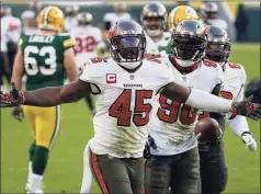  ?? Mike Roemer / Associated Press ?? The Buccaneers’ Devin White (45) celebrates after picking up a fumble by Packers RB Aaron Jones (33) during the Jan. 24 NFC championsh­ip game.