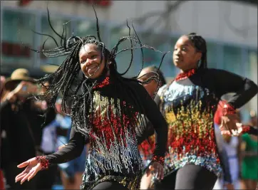  ?? SHAE HAMMOND — STAFF PHOTOGRAPH­ER ?? Dancers entertain the crowd at the Black Joy Parade on Broadway Street in Oakland on Feb. 27, 2022.