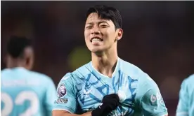  ?? Photograph: Jack Thomas/WWFC/Wolves/Getty Images ?? Hwang Hee-chan scored twice in 15 minutes as Wolves beat Brentford 4-1, but went off injured just before half-time.