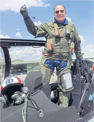  ??  ?? In this file photo taken on June 11, 1999, Serge Dassault poses for the photograph­er in the cockpit of a Rafale after a flight before the 43rd Paris Air Show.