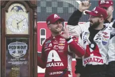  ?? CHUCK BURTON/AP ?? WILLIAM BYRON (CENTER) celebrates with crew members in Victory Lane after receiving the trophy for winning the Cup Series auto race at Martinsvil­le Speedway in Martinsvil­le, Va., April 7.