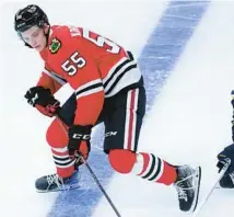  ?? CHRIS SWEDA/CHICAGO TRIBUNE ?? Blackhawks defenseman Kevin Korchinski looks to gain control of the puck during a preseason game against the Blues on Sept. 28 at the United Center.