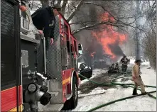  ??  ?? Firefighte­rs battle A blaze engulfing garage in Douglass (Berks) Township on Feb. 11. The structure was a total loss.