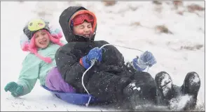  ?? Hearst Connecticu­t Media file photo ?? Siblings Anne, 6, and Ethan Arnett, 8, of Fairfield, enjoy a snow day off from school with a morning of sledding at Sturges Park in Fairfield on Feb. 12, 2019.
