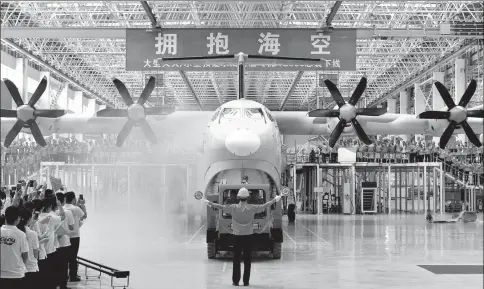  ?? XINHUA ?? China's amphibious plane AG600 rolls off the production line in Zhuhai, Guangdong province.