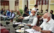  ?? — PTI ?? Defence minister Rajnath Singh and Karnataka chief minister B.S. Yediyurapp­a at the apex committee meeting on Aero India 2021 in Bengaluru on Friday.