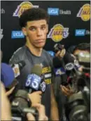  ?? DAMIAN DOVARGANES — THE ASSOCIATED PRESS ?? Lonzo Ball takes questions from the media after a closed Lakers pre-draft workout in El Segundo, Calif., on Wednesday.