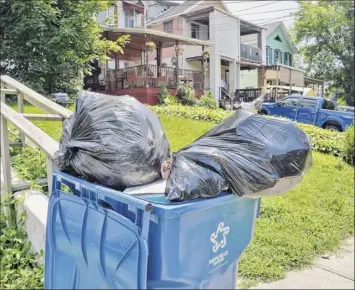  ?? John Carl d’annibale / times union ?? trash cans outside a house on east Sunnyside Aug. 7 in troy. the trash fee will rise $4 in the mayor’s proposed 2019 budget to a total of $164 per unit.