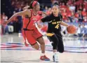  ?? JOSH GALEMORE / ARIZONA DAILY STAR ?? Arizona guard Aarion McDonald (2) guards Arizona State guard Kiara Russell (4) last season.