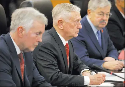  ?? Mark Schiefelbe­in ?? The Associated Press Defense Secretary Jim Mattis, center, attends a meeting Wednesday with China’s Defense Minister Wei Fenghe in Beijing.