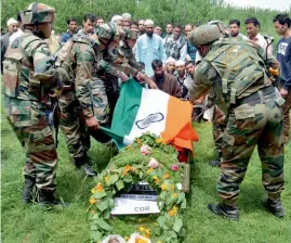  ?? — PTI ?? Army personnel pay tribute to slain Army officer Lt. Umar Fayyaz Parray during his funeral at his native village of Sudsona in J&K’s Kulgam district on Wednesday.