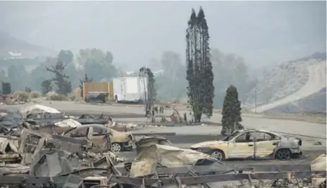  ?? JONATHAN HAYWARD/THE CANADIAN PRESS ?? A wildfire ripped through Boston Flats, B.C., last week. More than 160 fires are burning in the province, with 14 posing a direct threat to communitie­s.