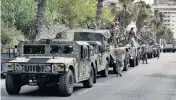  ?? BILAL HUSSEIN AP ?? Lebanese army vehicles patrol a street in Beirut on Saturday. Lebanese authoritie­s began distributi­ng ballot boxes to polling stations around the country on Saturday, a day before parliament­ary elections were to be held.