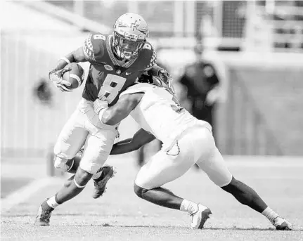  ?? MICHAEL CHANG/GETTY IMAGES ?? When WR Nyqwan Murray gets the ball for the Seminoles, he can count on his grandmothe­r Annie Collin being the loudest person in the stands.